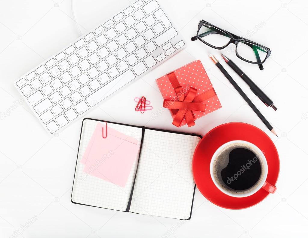 Red coffee cup, gift box and office supplies