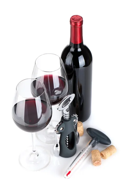 Red wine bottle, glasses, corkscrew, corks and thermometer — Stock Photo, Image