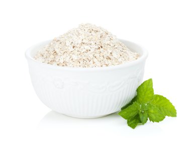 Oat flakes in bowl and mint clipart