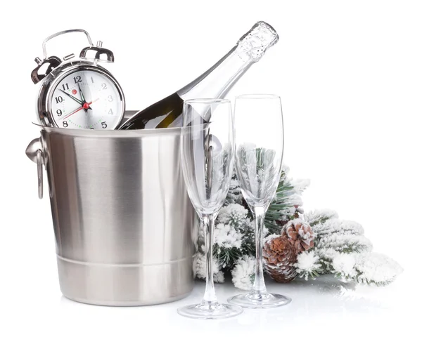 Champagne bottle, glasses and alarm clock — Stock Photo, Image