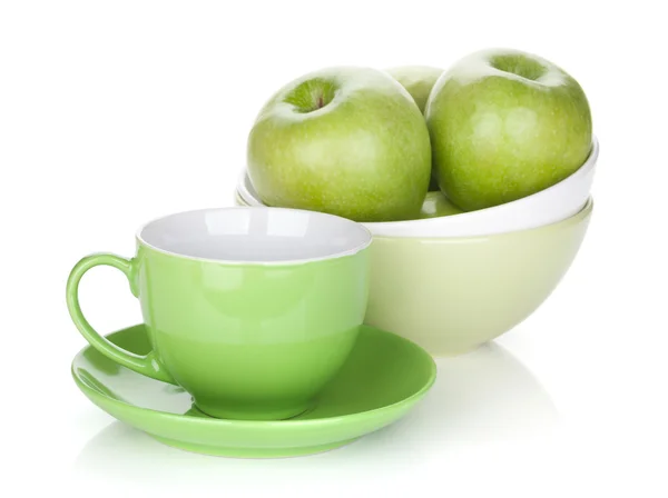 Green apples and tea cup — Stock Photo, Image