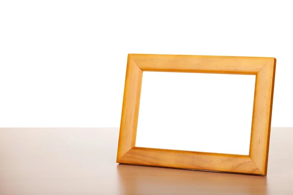 Photo frame on wood table — Stock Photo, Image