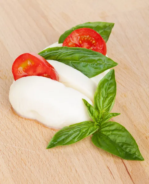 Mozzarella, tomatoes and basil — Stock Photo, Image