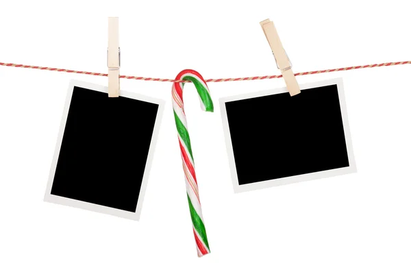 Blank photos hanging on clothesline — Stock Photo, Image
