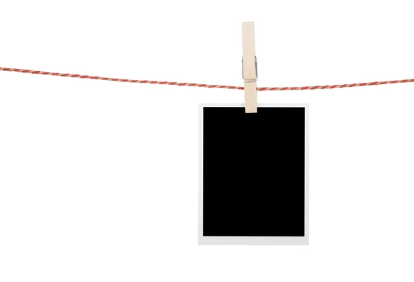 Blank photo hanging on clothesline — Stock Photo, Image