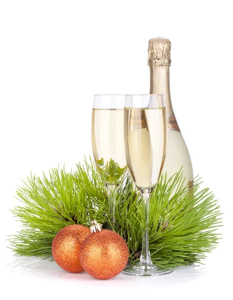 Champagne glasses, bottle, baubles and fir tree — Stock Photo, Image