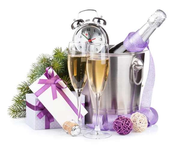 Christmas champagne with alarm clock in bucket and gift box — Stock Photo, Image