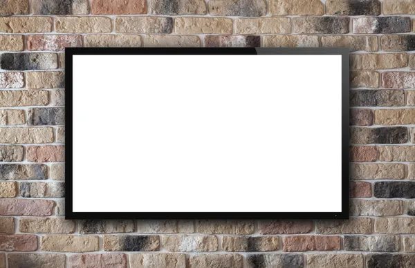 Display de TV na parede de tijolo — Fotografia de Stock