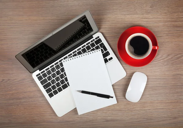 Blank notepad over laptop and coffee cup — Stock Photo, Image