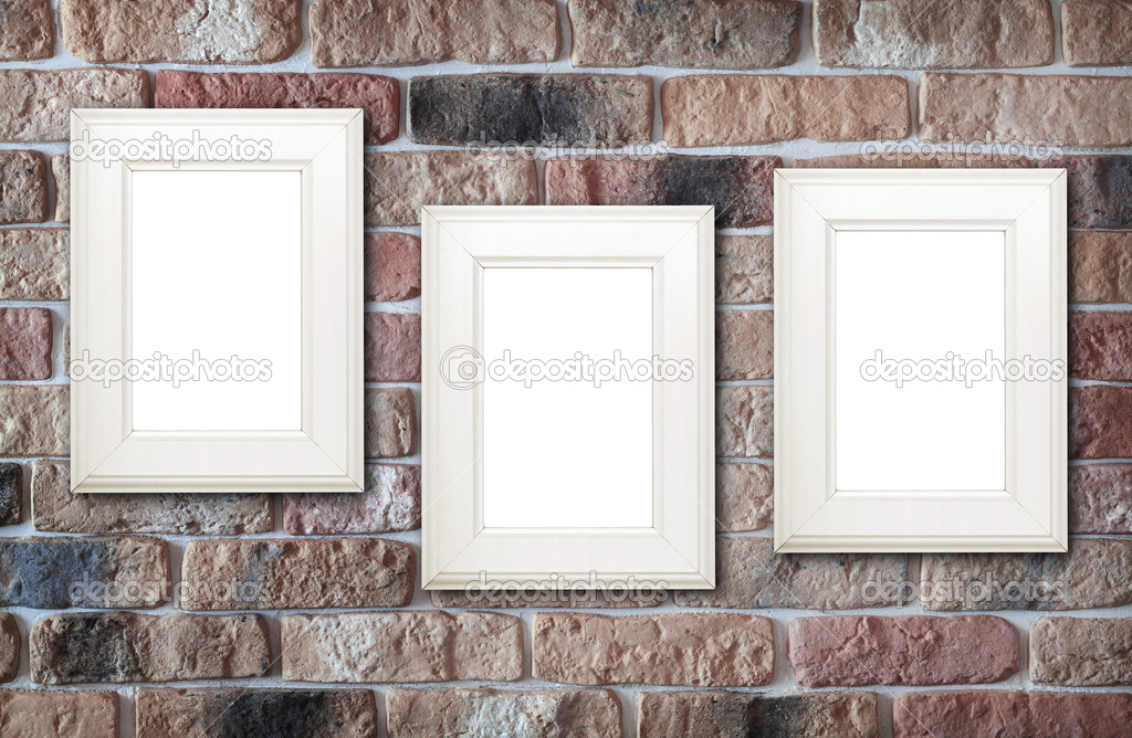 Photo frames on brick wall Stock Photo by ©karandaev 36013739