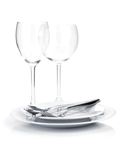 Silverware or flatware on plates and wine glasses — Stock Photo, Image