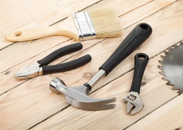 Set of tools on wood background — Stock Photo, Image