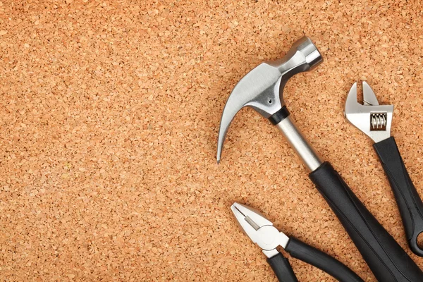 Set of tools on cork background — Stock Photo, Image