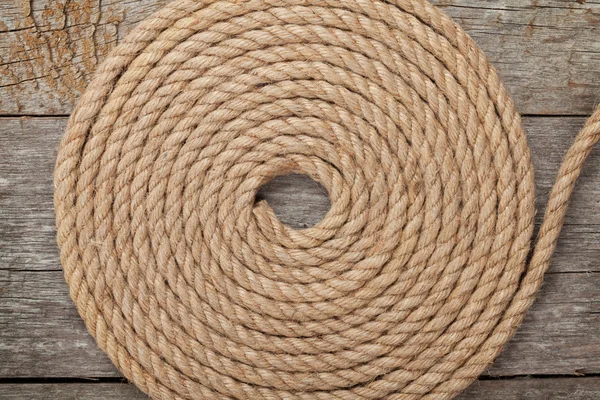 Ship rope on wooden texture background — Stock Photo, Image