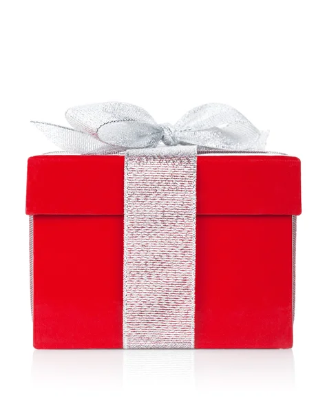 Red gift box with silver ribbon and bow — Stock Photo, Image