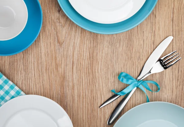 Kitchen utensils over wooden table — Stock Photo, Image