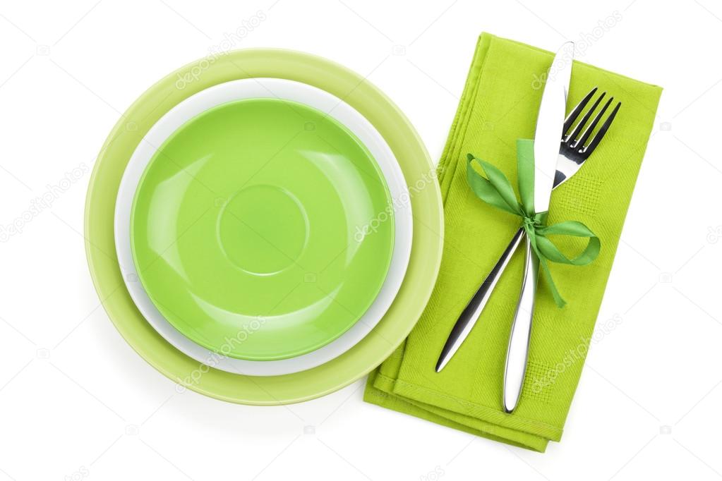 Fork with knife over towel and empty plates
