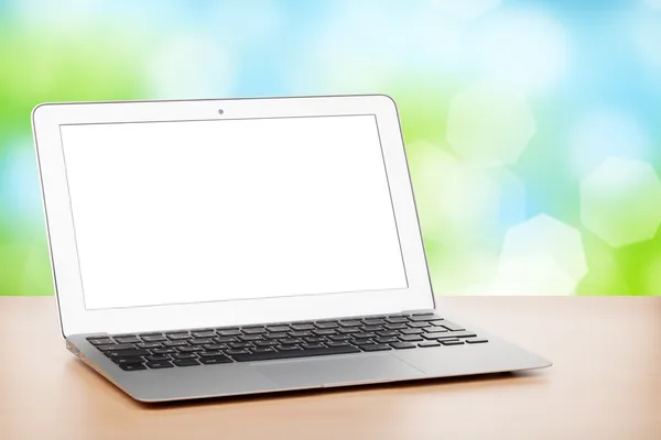 Laptop with blank screen on table — Stock Photo, Image