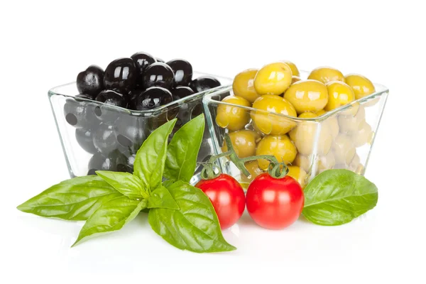 Black and green olives and tomatoes with basil — Stock Photo, Image