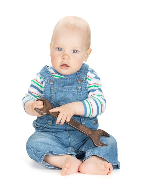 Liten söt baby boy arbetare i jeans — Stockfoto