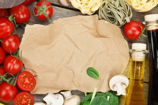 Fresh ingredients for cooking: pasta, tomato, mushroom and spice — Stock Photo, Image