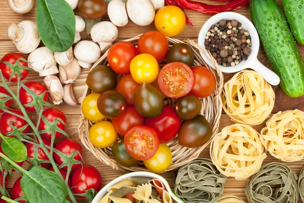 Fresh ingredients for cooking: pasta, tomato, cucumber, mushroom — Stock Photo, Image