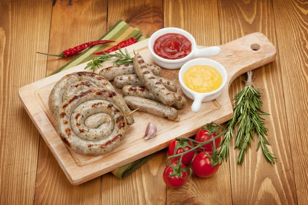 Grilled sausages with ketchup and mustard — Stock Photo, Image