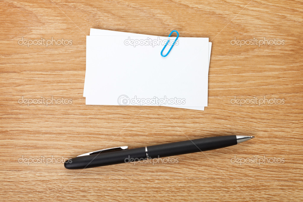 Blank business cards over office table