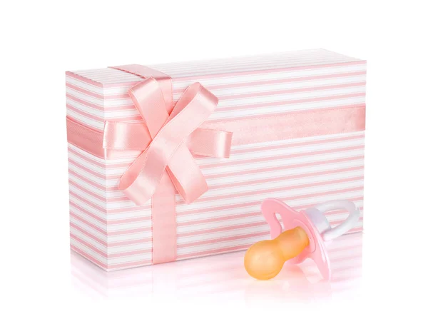 Gift box and pacifier for little girl — Stock Photo, Image