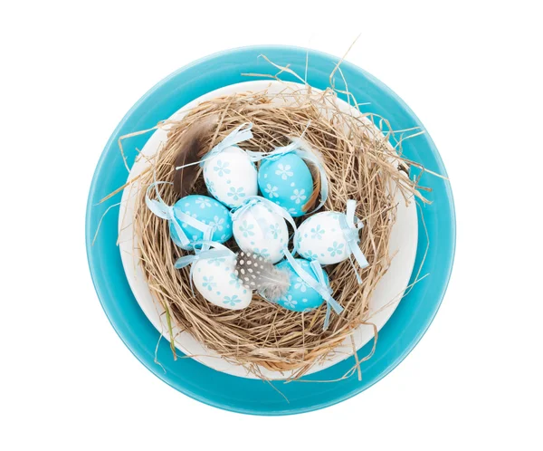 Easter eggs nest on plate — Stock Photo, Image