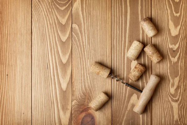 Corkscrew and wine corks — Stock Photo, Image