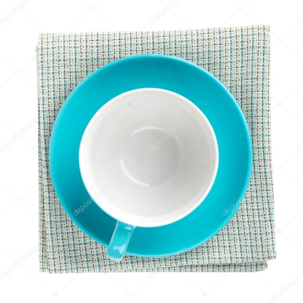 Blue coffee cup over kitchen towel