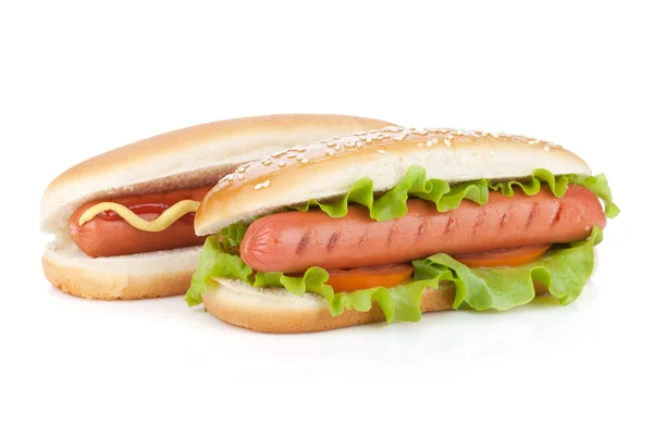 Twee hotdogs met verschillende ingrediënten — Stockfoto