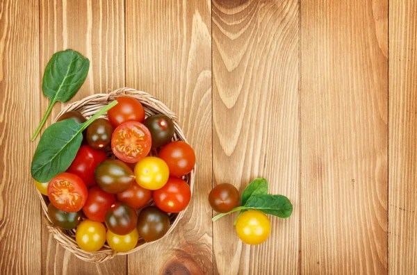 Cherry tomatoes on table — Stock Photo, Image