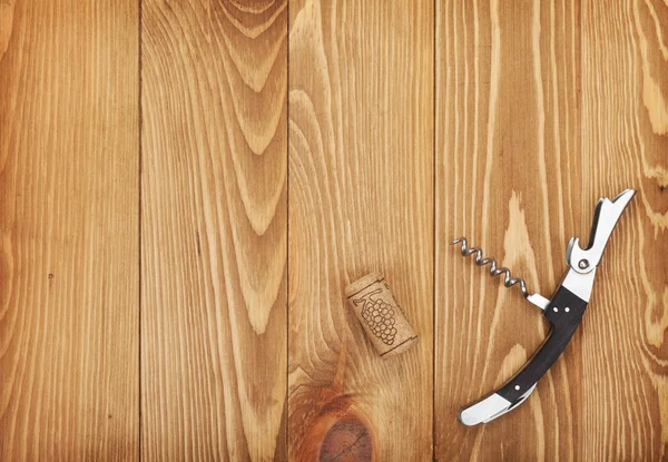 Corkscrew and wine cork — Stock Photo, Image