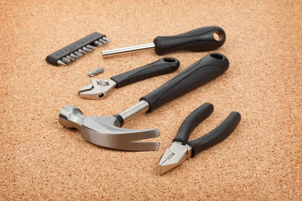 Set of tools on cork background — Stock Photo, Image