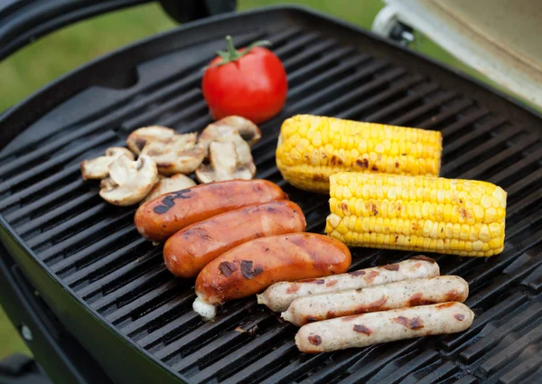 Grill bbq sausages and vegetables — Stock Photo, Image