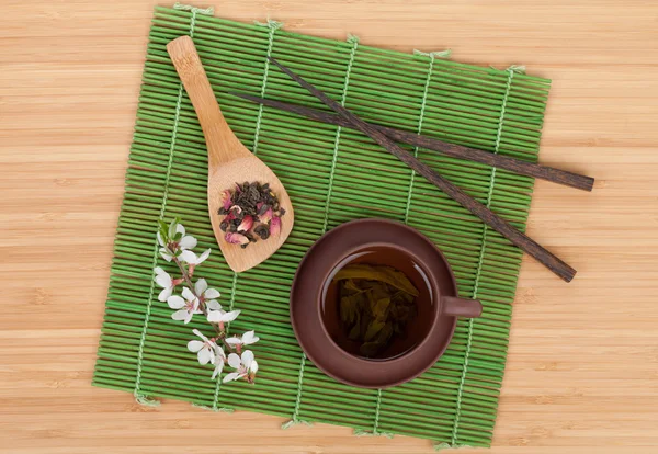 Japanese green tea and sakura branch — Stock Photo, Image