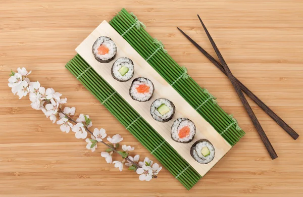 Sushi set with fresh sakura branch — Stock Photo, Image