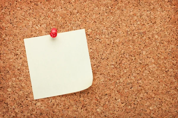 Blank postit note on cork notice board — Stock Photo, Image