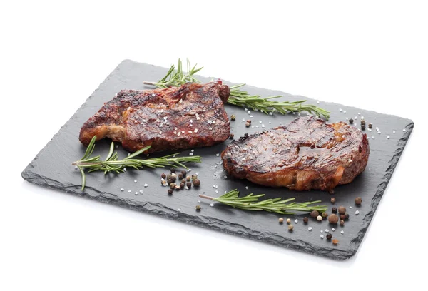 Beef steaks with rosemary and spices — Stock Photo, Image