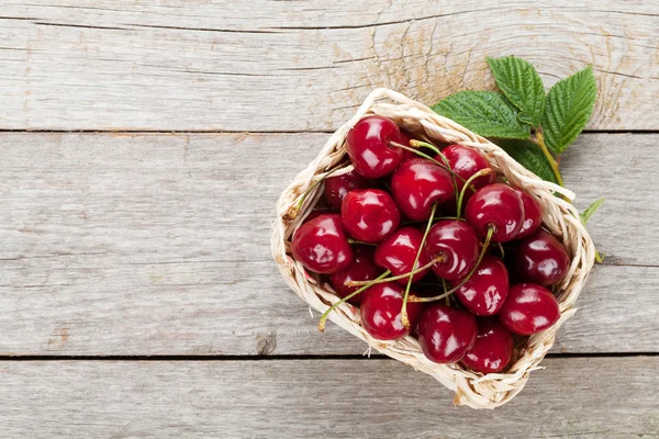 Ripe cherries on wooden table — Stock Photo, Image