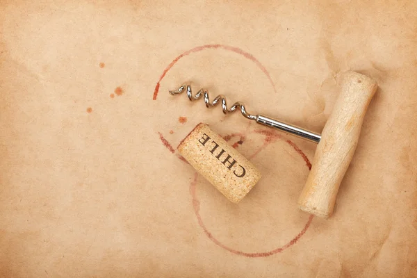 Cork and corkscrew with red wine stains — Stock Photo, Image