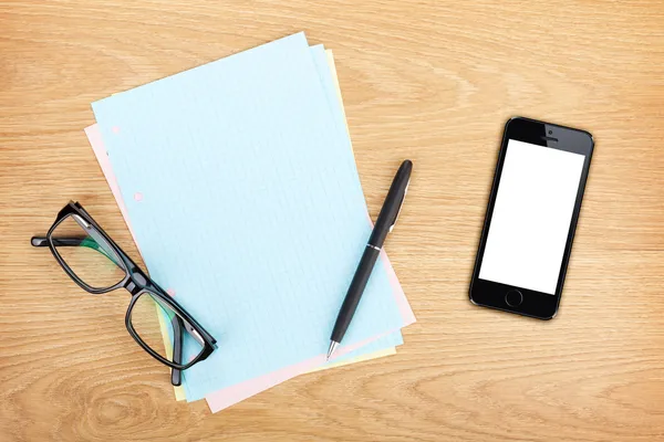 Papier met mobiele telefoon en glazen — Stockfoto