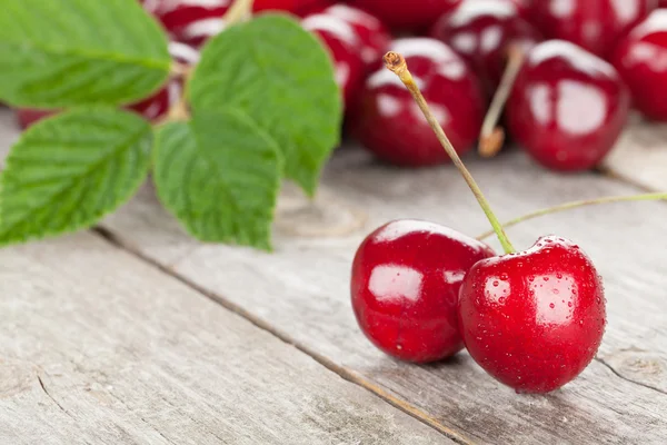 Cherries on wooden table — Stock Photo, Image