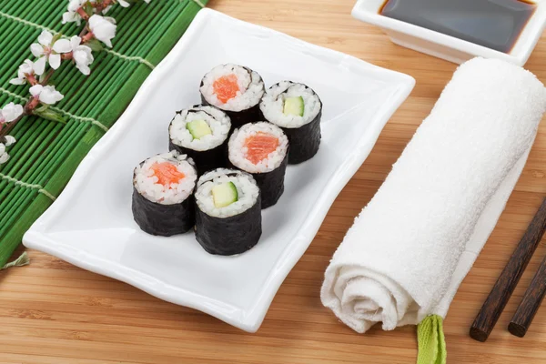 Maki sushi  with sakura branch — Stock Photo, Image