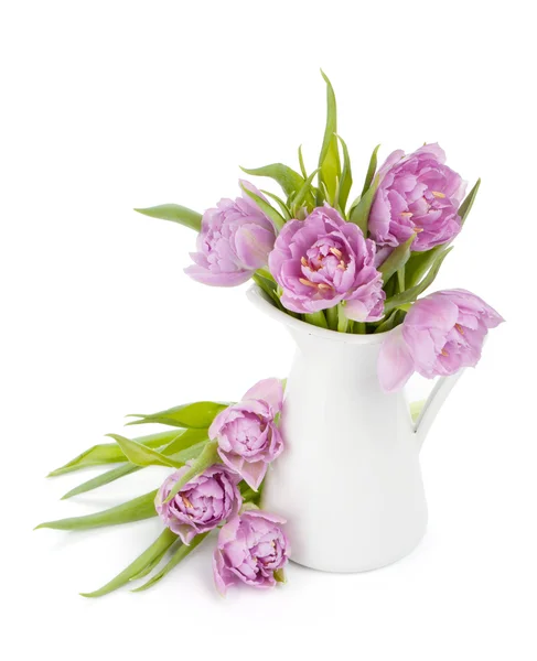 Růžové tulipány v džbánu — Stock fotografie
