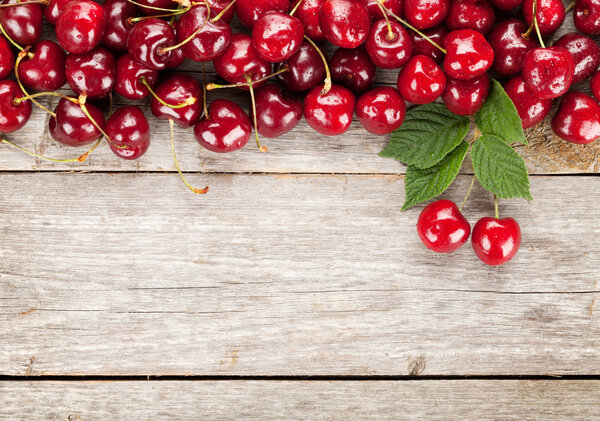 Cherries on wooden table