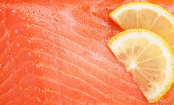 Salmon fish with lemon slices — Stock Photo, Image