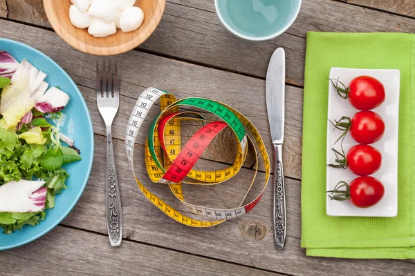 Food and measuring tape — Stock Photo, Image